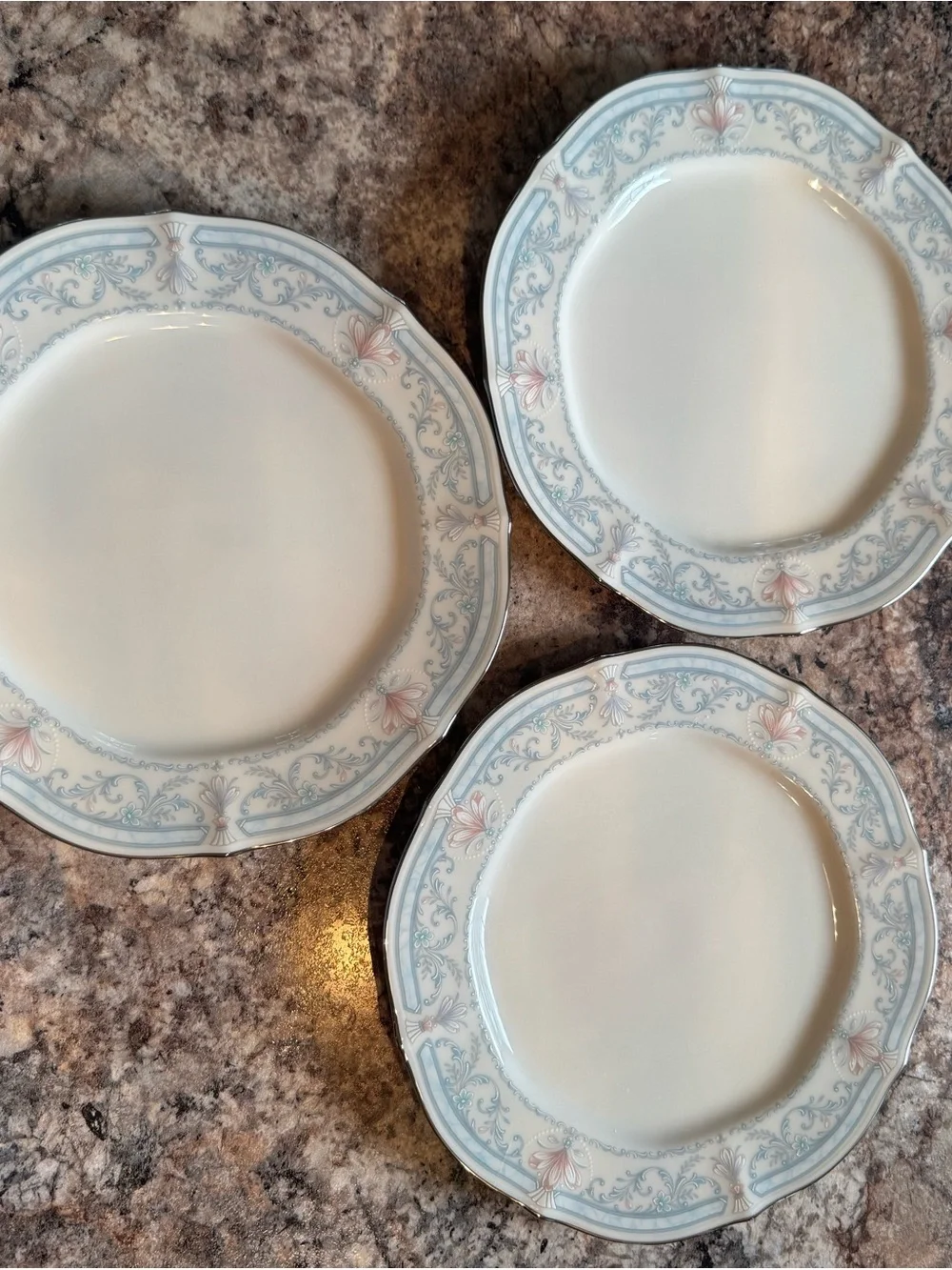 Noritake Crown Flower Dinnerware with Pale Blue and Soft Pink Floral Border